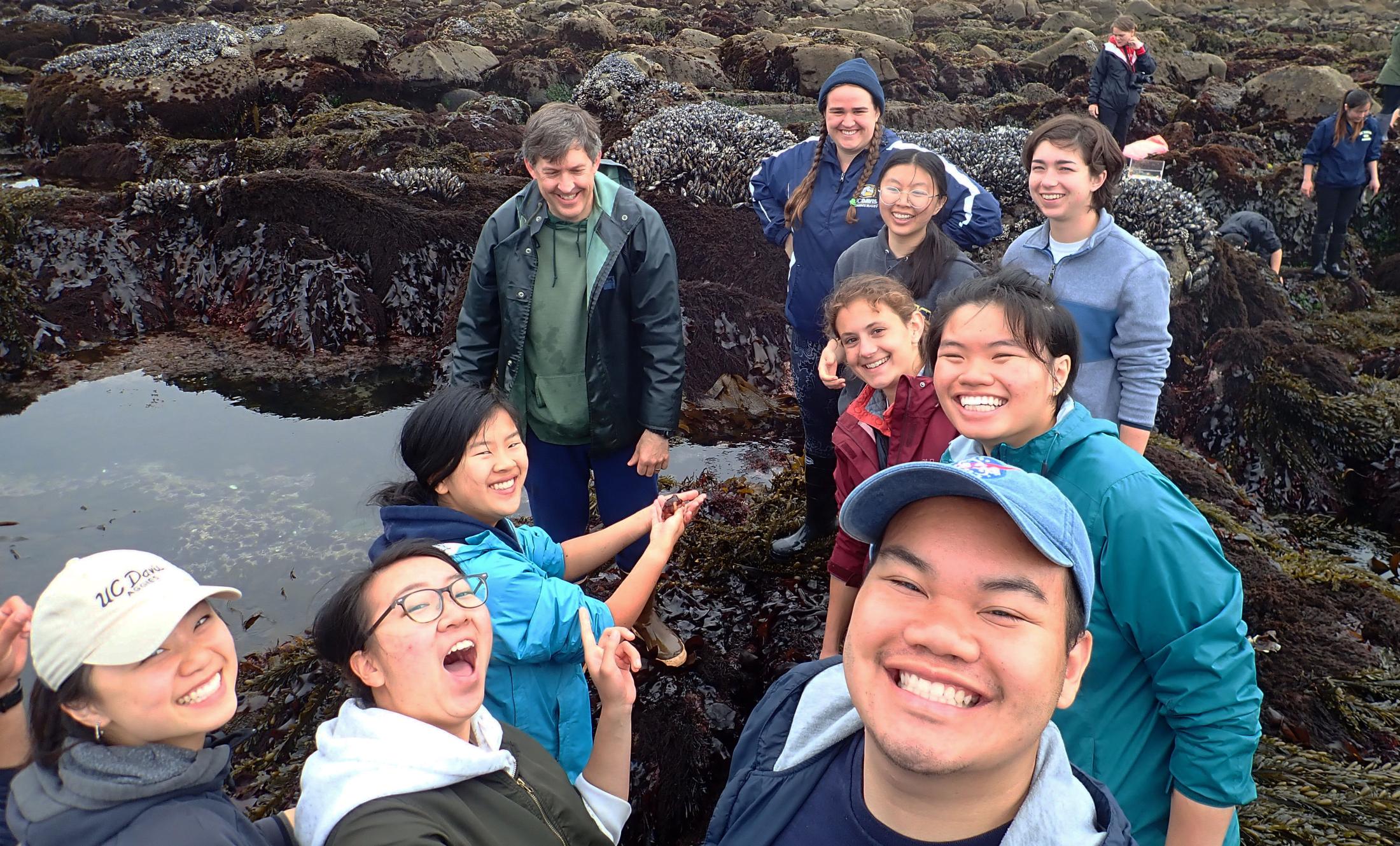 Eric Sanford's students check out a small octopus