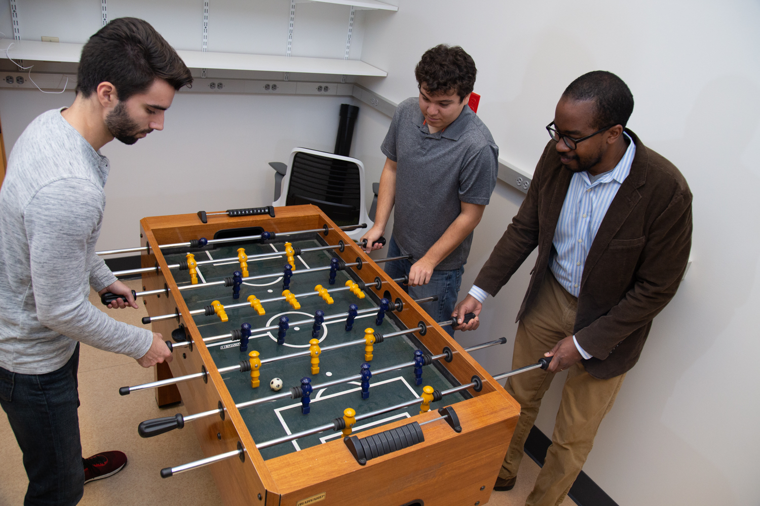 Wilsaan Joiner and lab members play some foosball