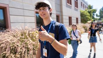 A young man giving a thumbs up