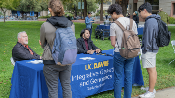 Students meet with representatives at the UC Davis Integrative Genetics and Genomics Graduate Group table.