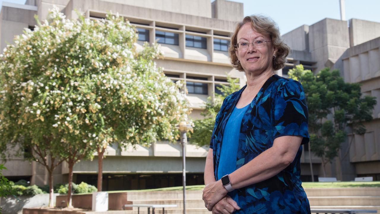 Michele Igo, who holds an appointment in the Department of Microbiology and Molecular Genetics, was named associate dean of undergraduate academic programs. David Slipher/UC Davis Michele Igo stands in the courtyard outside the Life Sciences Building