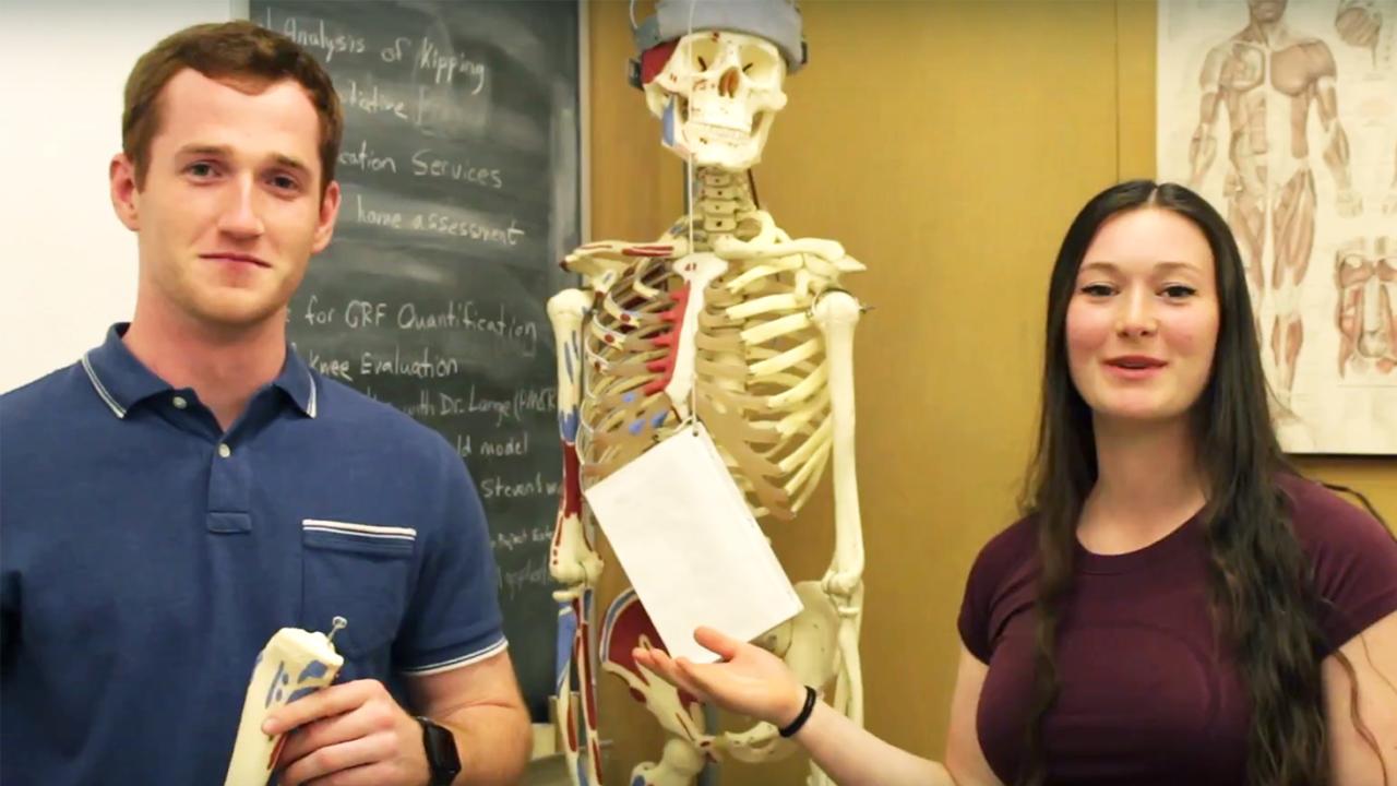 Tanner Van Es and Jennifer Addleman recently won the inaugural NPB Vlog Contest, organized by Rebecca Calisi Rodríguez, an assistant professor in the Department of Neurobiology, Physiology and Behavior. Tanner Van Es and Jennifer Addleman stand near a skeleton in the Human Performance Lab