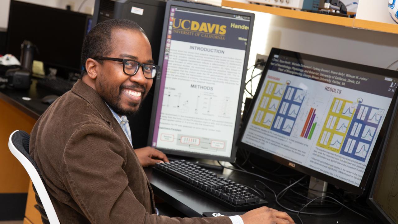 Wilsaan Joiner sits at his desk