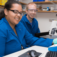 Student and faculty member at computer