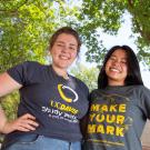 Two UC Davis students pose under trees