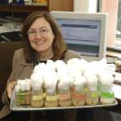 Professor Deborah Kimbrell holds a tray of fruit fly specimens