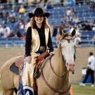 Young woman and horse during a football game